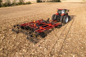 Red Case IH tractor pulling red Case IH VT-Flex 435 through corn stubble