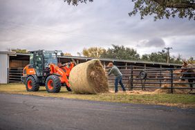 Kubota wheel loader with hay and farmer