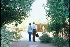 women walking on a path