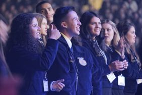 FFA students stand wearing blue jackets at National FFA Convention