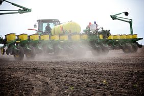 A John Deere tractor and planter working in an Iowa field