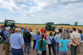 participants gather at farm tour stop