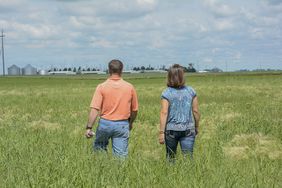 farmer and wife walking