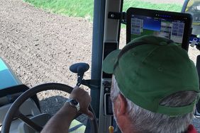 farmer driving tractor