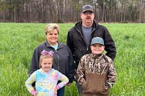 Family of four in a pasture