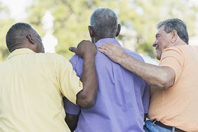 three men consoling