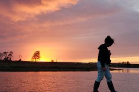 Carol Bouska on wetland dike