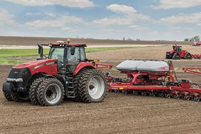 Case IH tractor and Early Riser 2150 planter in field