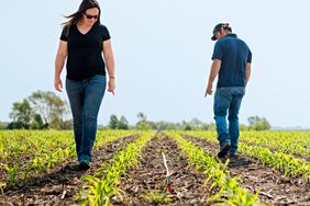 Summer and Dan Ory in their field