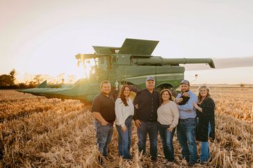 Fritz, Anna, Robert, Terri, Shelby, baby Hesston, and Tannah Lager on the family farm in northwest Missouri