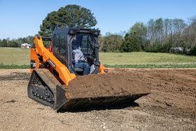 Develon Compact Track Loader moving dirt