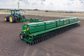 The BD7600 50 foot box drill in the field pulled by a John Deere tractor.