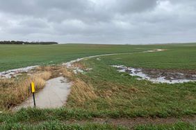 Grass waterway full of rain water in South Dakota