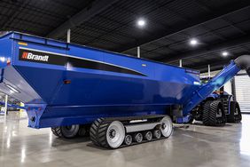 The Brandt dual-auger DXT GrainCart in a warehouse.