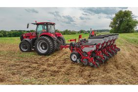 A Case IH tractor pulling the Early Riser 2120 planter.