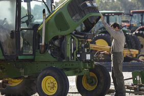 Man examining tractor for sale