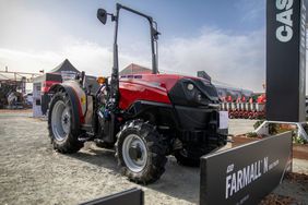 The Farmall N tractor at an outdoor trade show.