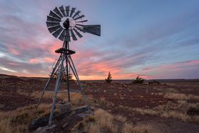 Pampa with old windmill on a farm in Bosques Petrificados de Jaramillo National Park, Patagonia, Argentina