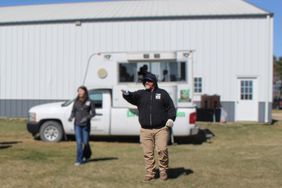 Tom Bradley takes bids for Dream Dirt Auctioneers at a Grundy County land auction.