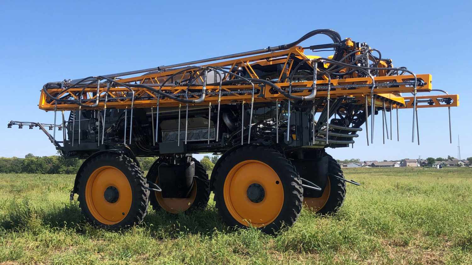 A tractor made by John Deere in partnership with Montag Manufacturing looks like a crop sprayer but seeds cover crops instead