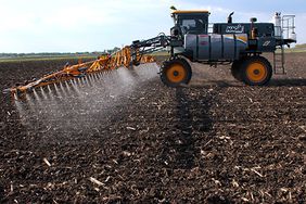 A Hagie sprayer in a field.