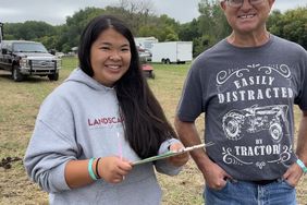 Hailey Gruber and Kevin Albrecht judging plowing contest.jpg