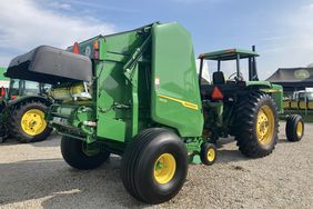 The John Deere 1 Series round baler connected to a John Deere 4250.