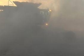 Soybean harvest in Minnesota showcasing the dust