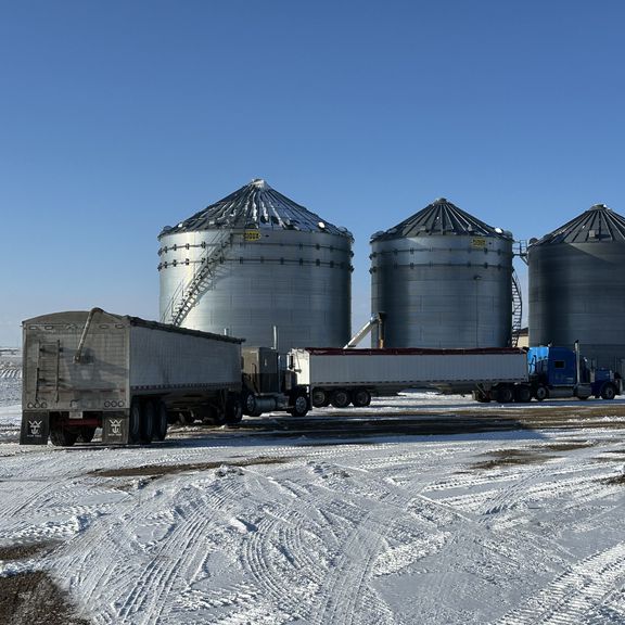 Grain hauling semis in the snow in South Dakota