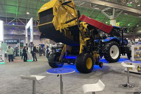 Yellow and red red baler with blue undercarriage lights