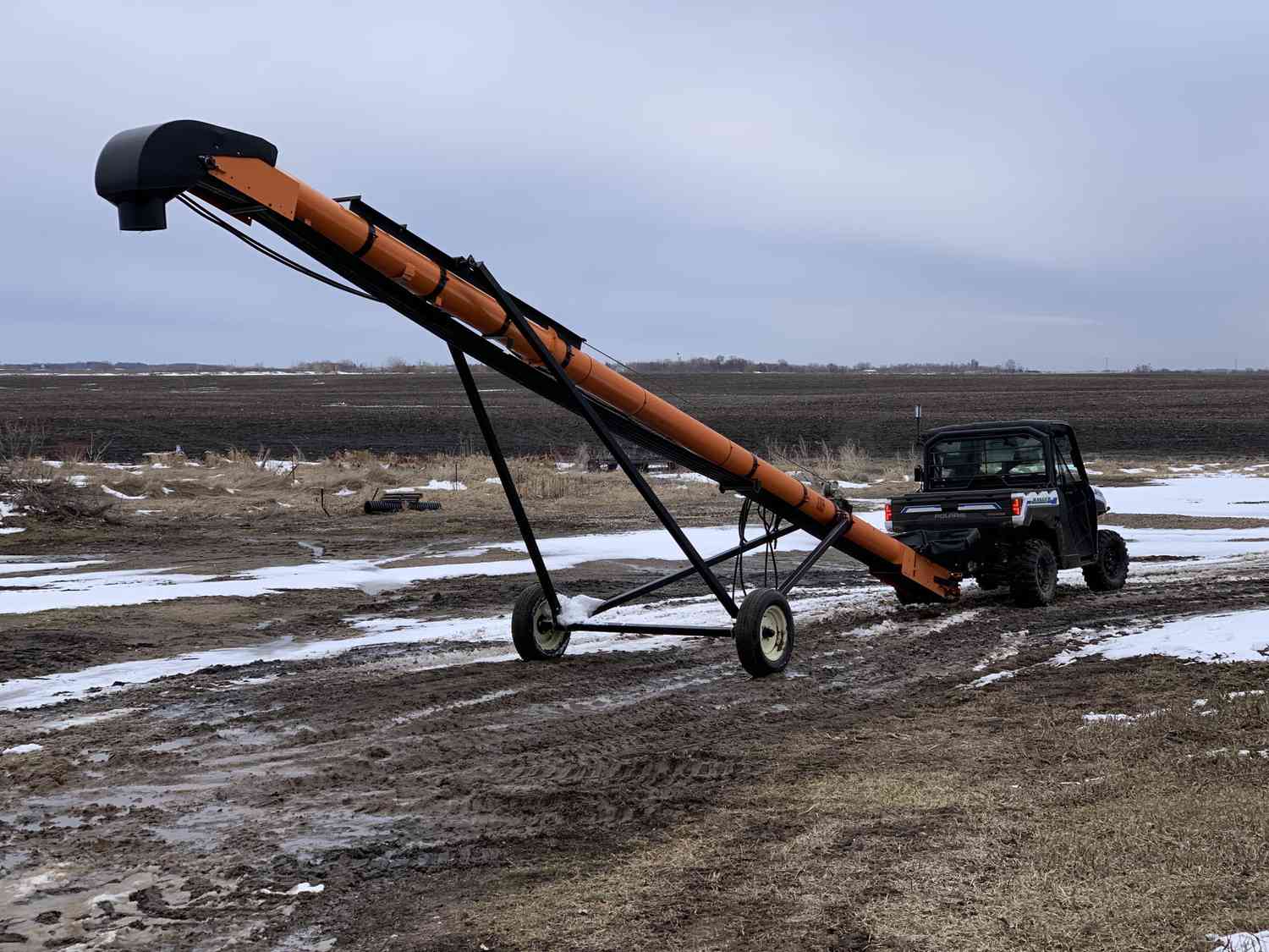 Zach Johnson pulls an auger with the Polaris Ranger XP Kinetic on his Minnesota farm