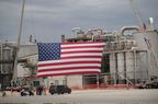 A flag is displayed in front of Southwest Iowa Renewable Energy