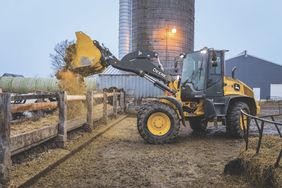 John Deere P-Tier 322 Compact Wheel Loader model on the farm.