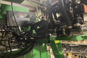 A John Deere planter equipped with Select Shot sits in the farm shop on Kelly Garrett's Iowa farm