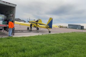 Yellow spray plane in South Dakota