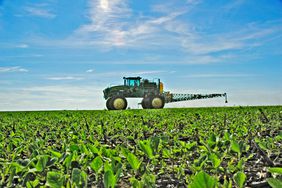 Tractor sprayer in field