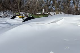 Nelsonâs venerable John Deere âAâ tractor was nearly buried by a snowdrift following a blizzard that arrived on March 17, 2023.