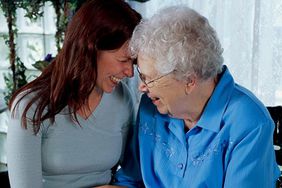 Elderly woman with caregiver