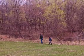 Jayson and Will Prater walking fence