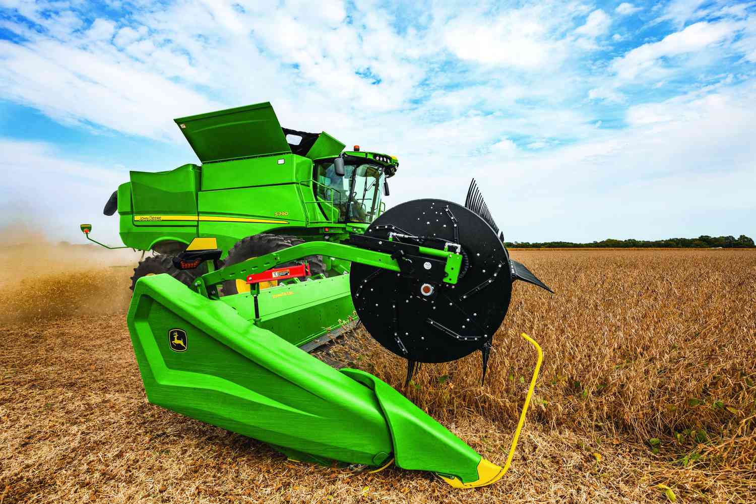 A model year 2022 John Deere S Series combine harvests soybeans