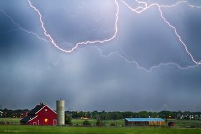 Dark clouds and lightning over farm