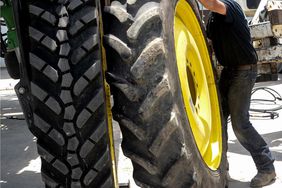 An image comparing sprayer and tractor tires.