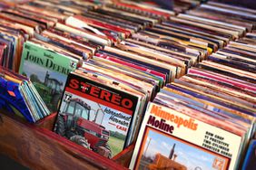 A photo showing fake album covers featuring tractors in a record shop