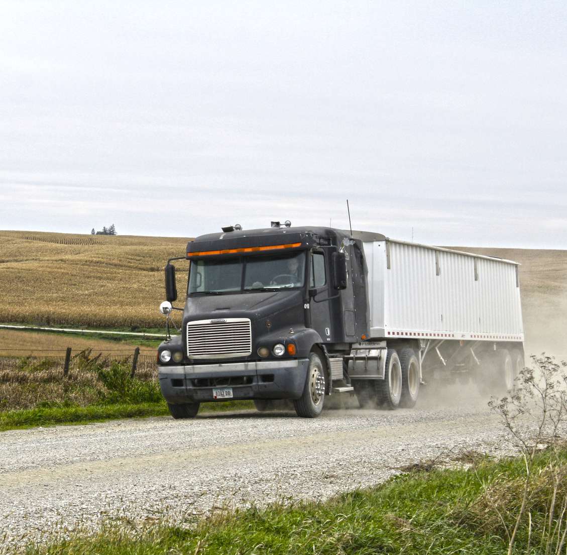 A semi on a gravel road.