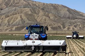 The fleet of Verdant's tractors in a field