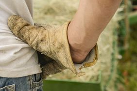 A farmer doing chores.