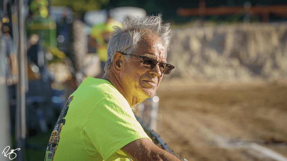 Don Slama watching a tractor pull competition. 