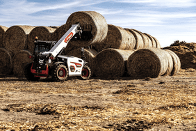 Bobcat telehandler lifting hay