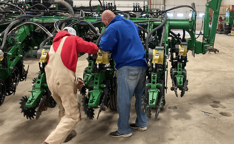 Kelly Garrett in the shop working on his John Deere planter in February 2022