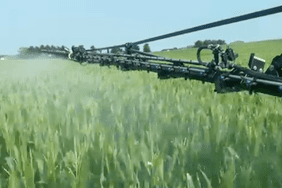 Dan Luepkes sprays his crop in Illinois